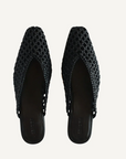 Pair of black woven shoes on a light gray background