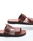 Pair of brown sandals on a white background