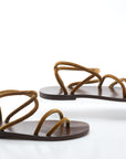 Pair of brown sandals on a white background