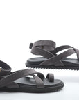 Pair of black sandals on a white background