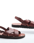 Pair of brown sandals on a white background