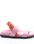 Pink sandal with orange strap on a white background