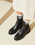 Model in Freda Salvador Brooke Rain Resistant Boot in Black Calf