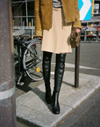 Model wearing NOMASEI Whisper Over the Knee Boot in Black