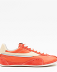 Orange sneaker with white accents on a white background