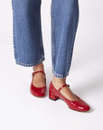 red glossy mary janes