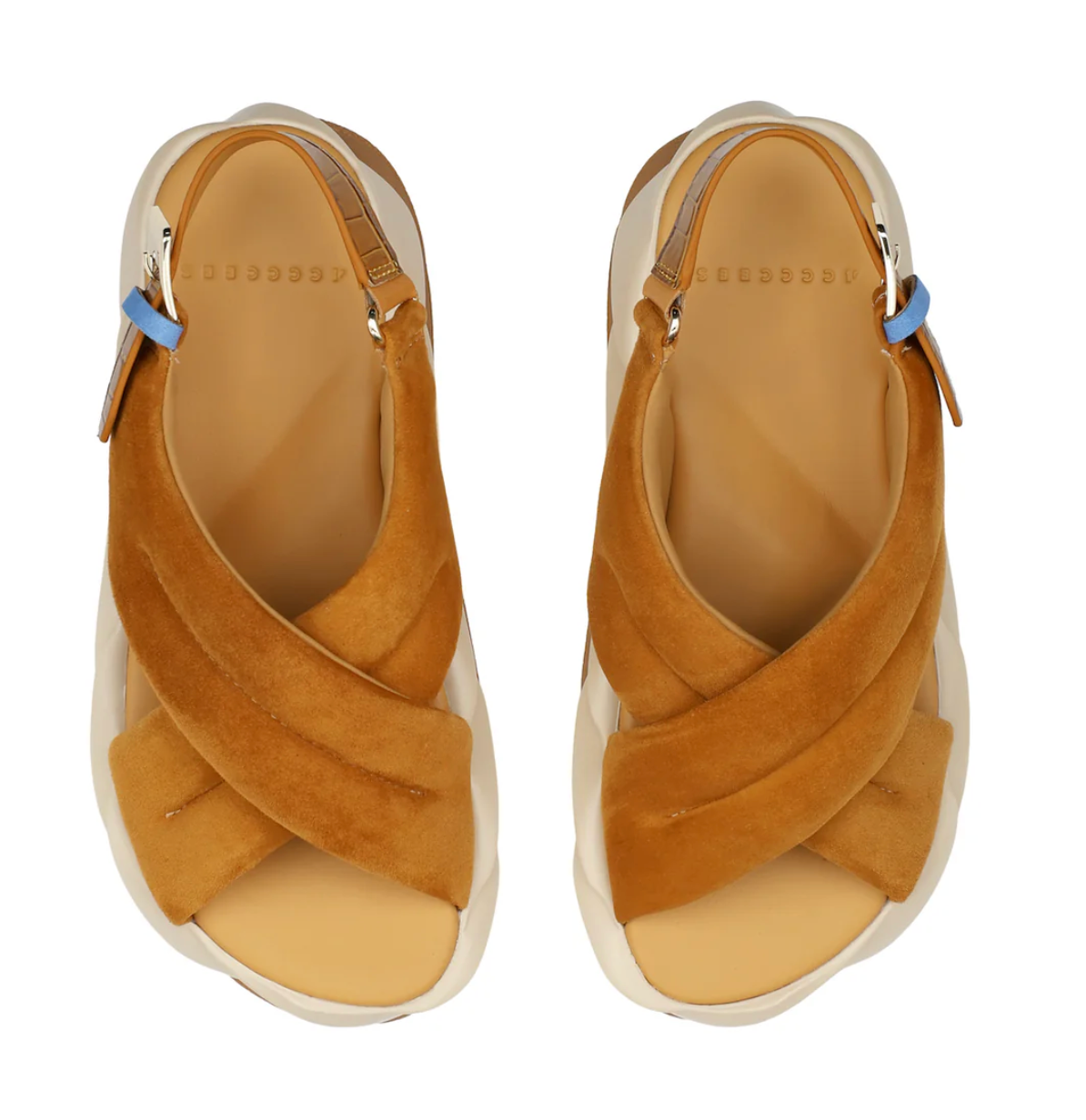 Pair of tan sandals with criss-cross straps on a white background