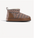 A single slip-on ankle boot with a brown leather side panel and sole, a brown, beige, and black woven patterned upper, and a white faux-fur lining, shown against a light gray background.
