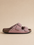 Pink sandal with a buckle on a beige background