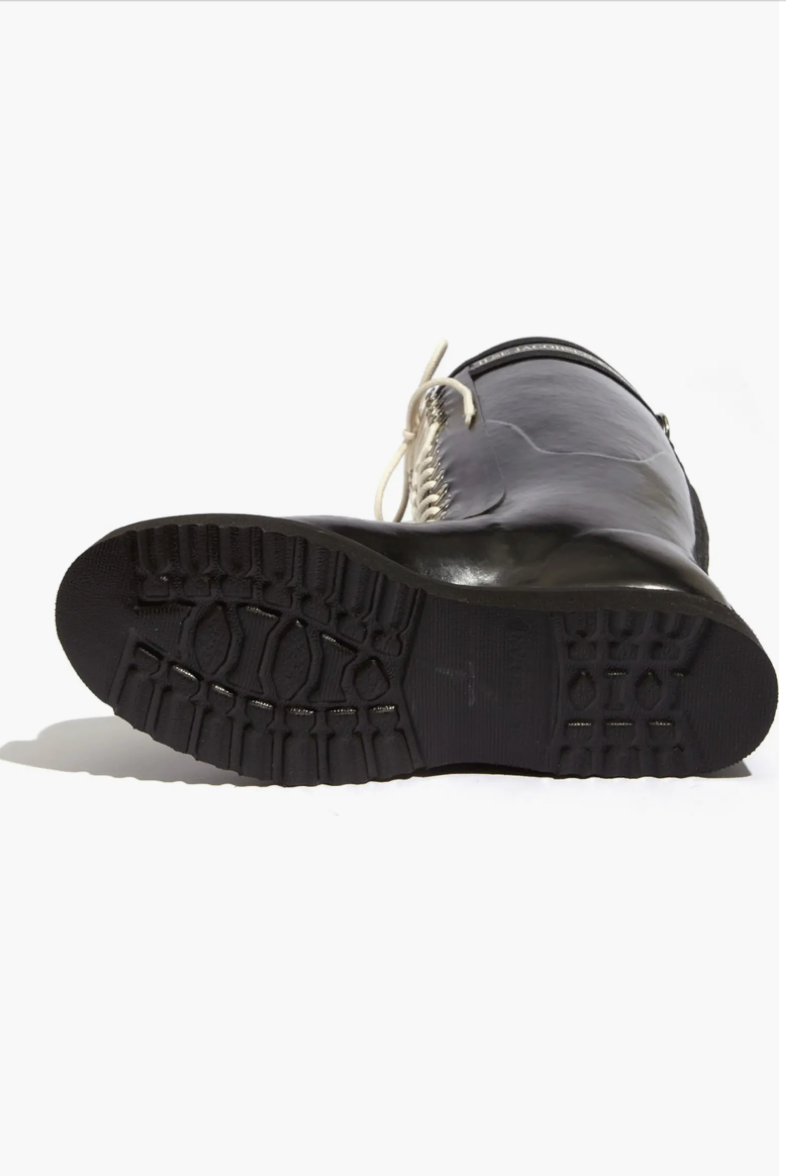 Black rubber boot with a white sole on a white background