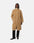 Person wearing a beige teddy coat on a white background
