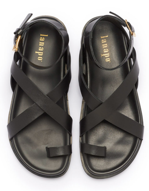 A pair of black strappy sandals with a polyurethane outersole, handcrafted in Italy.