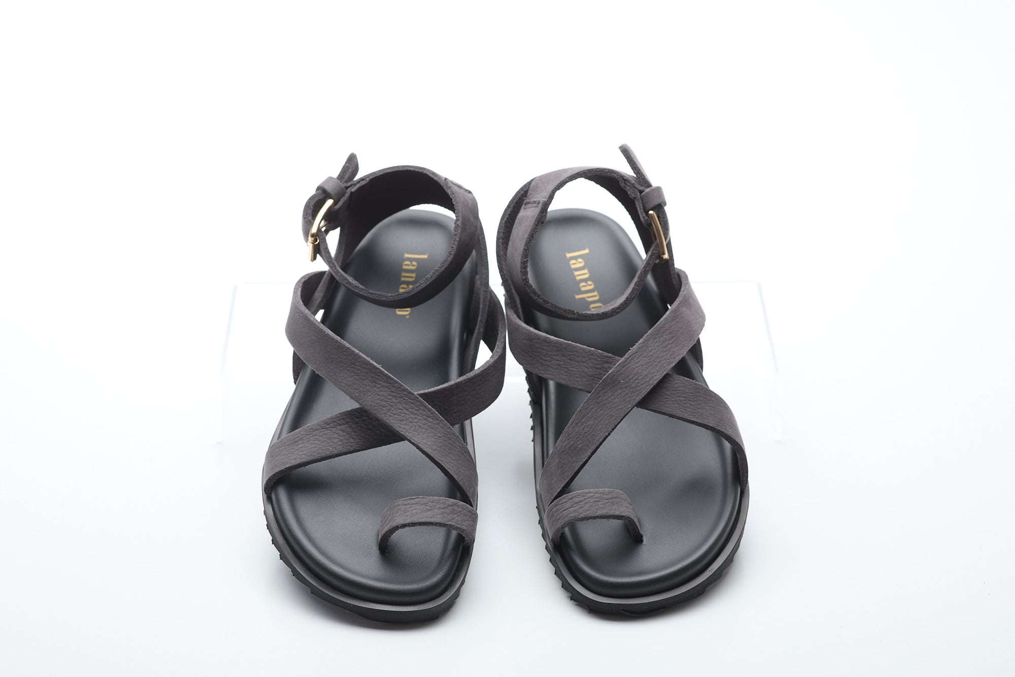 Pair of gray sandals on a white background