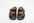 Pair of brown sandals with buckles on a white background