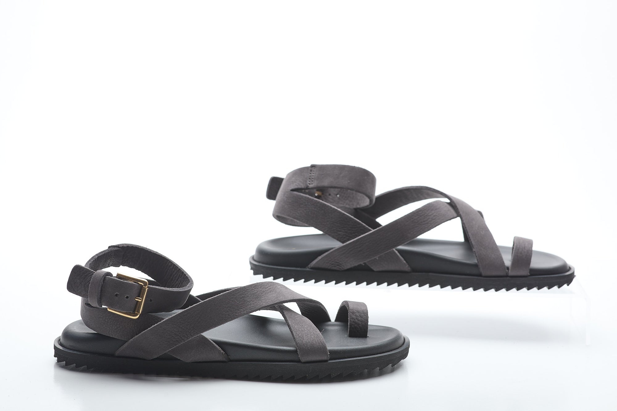 Pair of black sandals on a white background