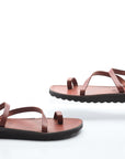 Pair of brown sandals on a white background