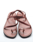 Pair of brown sandals on a white background