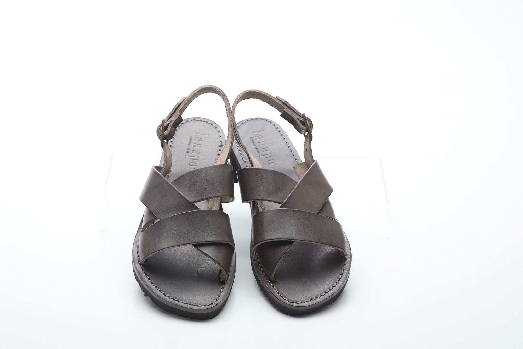 Pair of gray sandals on a white background
