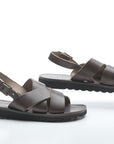 Pair of brown sandals on a white background