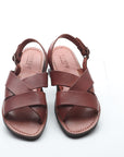 Pair of brown sandals on a white background