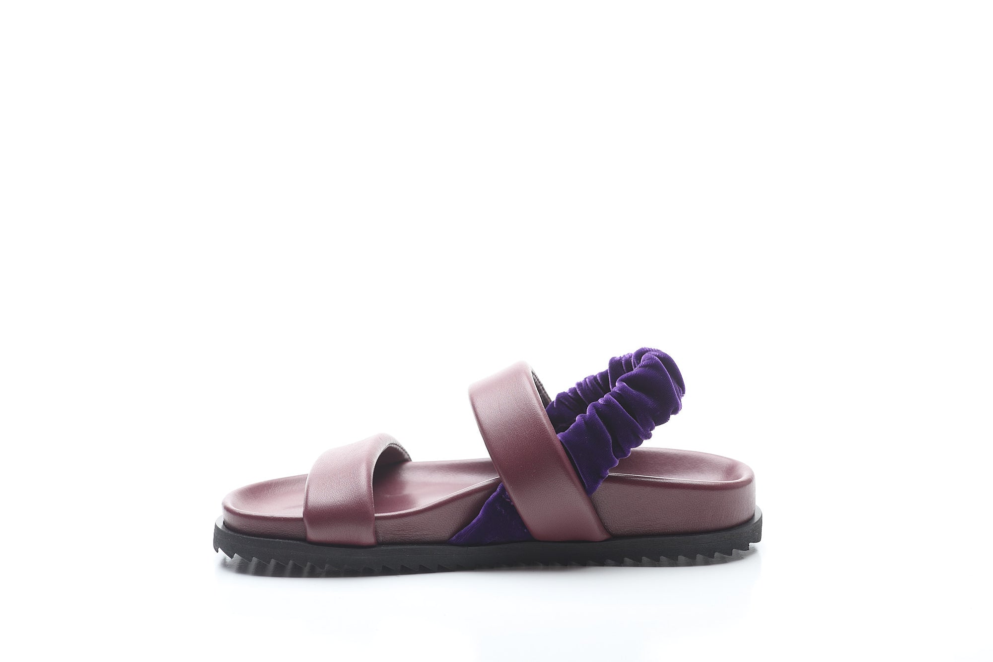 Purple sandal with a scrunchie on a white background