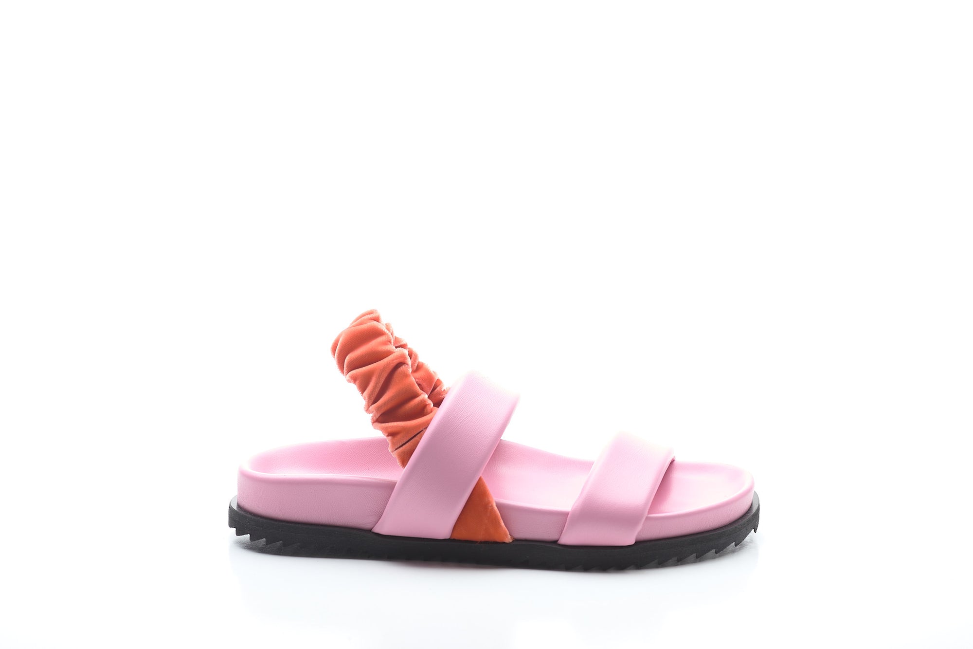 Pink sandal with orange strap on a white background