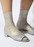 Model Wearing Maria La Rosa One Ribbed Laminated Socks in Platino 