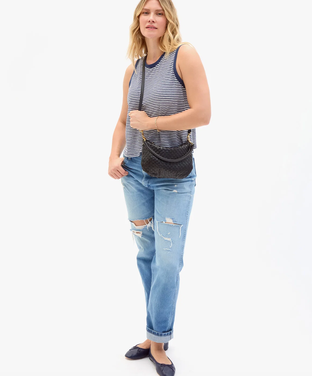 Model in Clare V. Petit Moyen Messenger in Black Woven Checker 