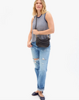 Model in Clare V. Petit Moyen Messenger in Black Woven Checker 