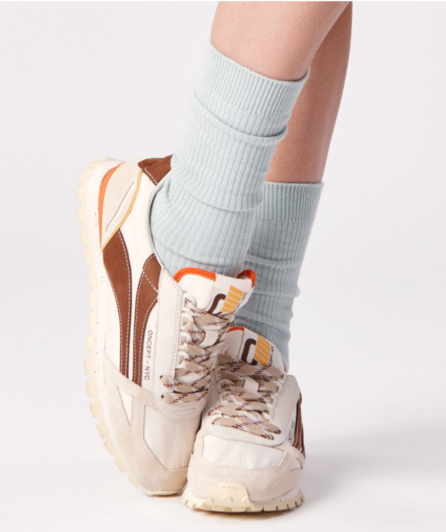 Model wearing Oncept Toronto in Stucco