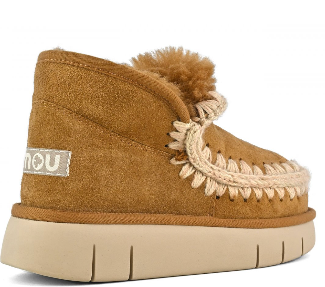 A brown MOU bounce sneaker with hand-crochet wool stitching and a chunky sole.