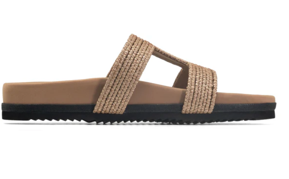 Brown sandal with a black sole on a white background