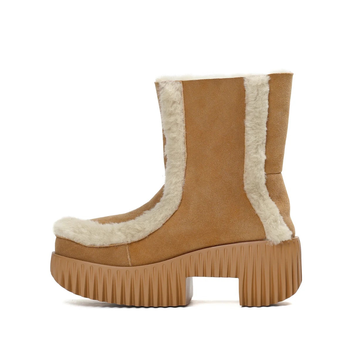Tan platform boot with white fur trim on a white background