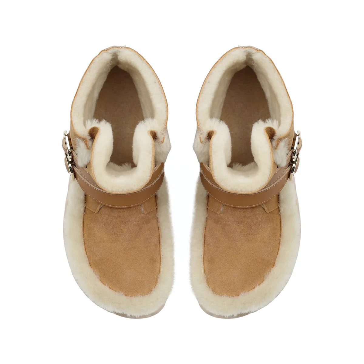Pair of tan sheepskin boots with white fur lining on a white background